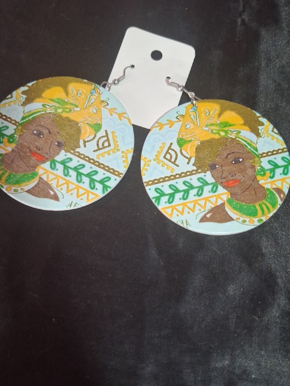 Hand-Painted Round Earrings Featuring Woman in Yellow Headwrap